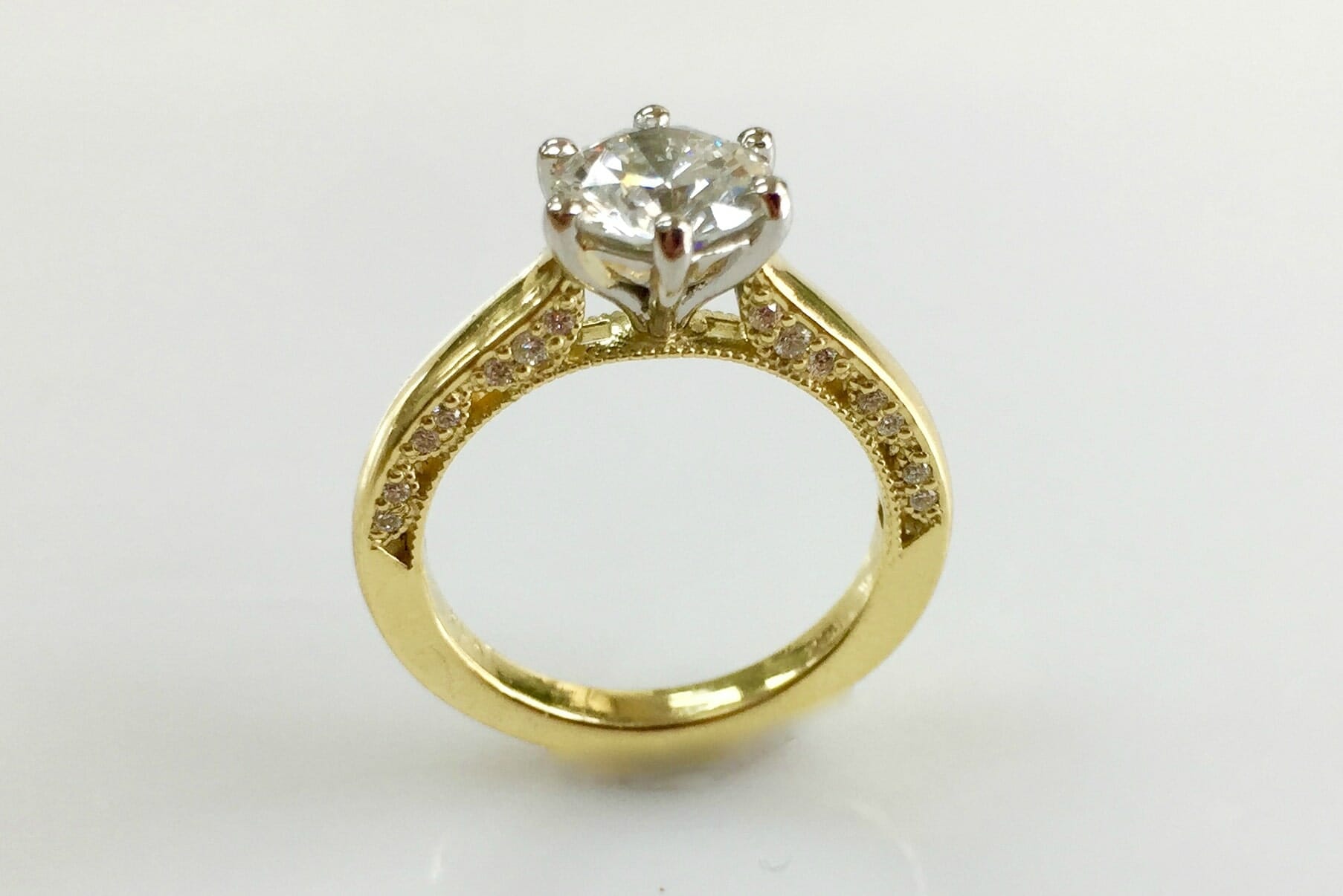 platinum and yellow gold diamond ring with side diamond trim front view
