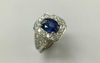 halo diamond and blue sapphire ring