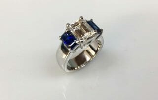 Ashley Platinum Three Stone Emerald Ring