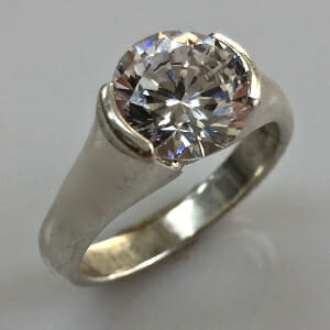 bezel set diamond engagement ring by keezing kreations