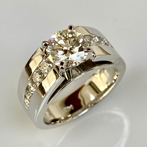 channel set diamond engagement ring with side diamonds by keezing kreations